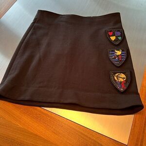 Rossignol black mini skirt with colorful patches. Size large